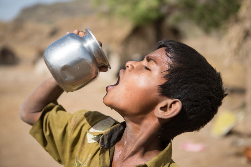 Child in India is drinking water